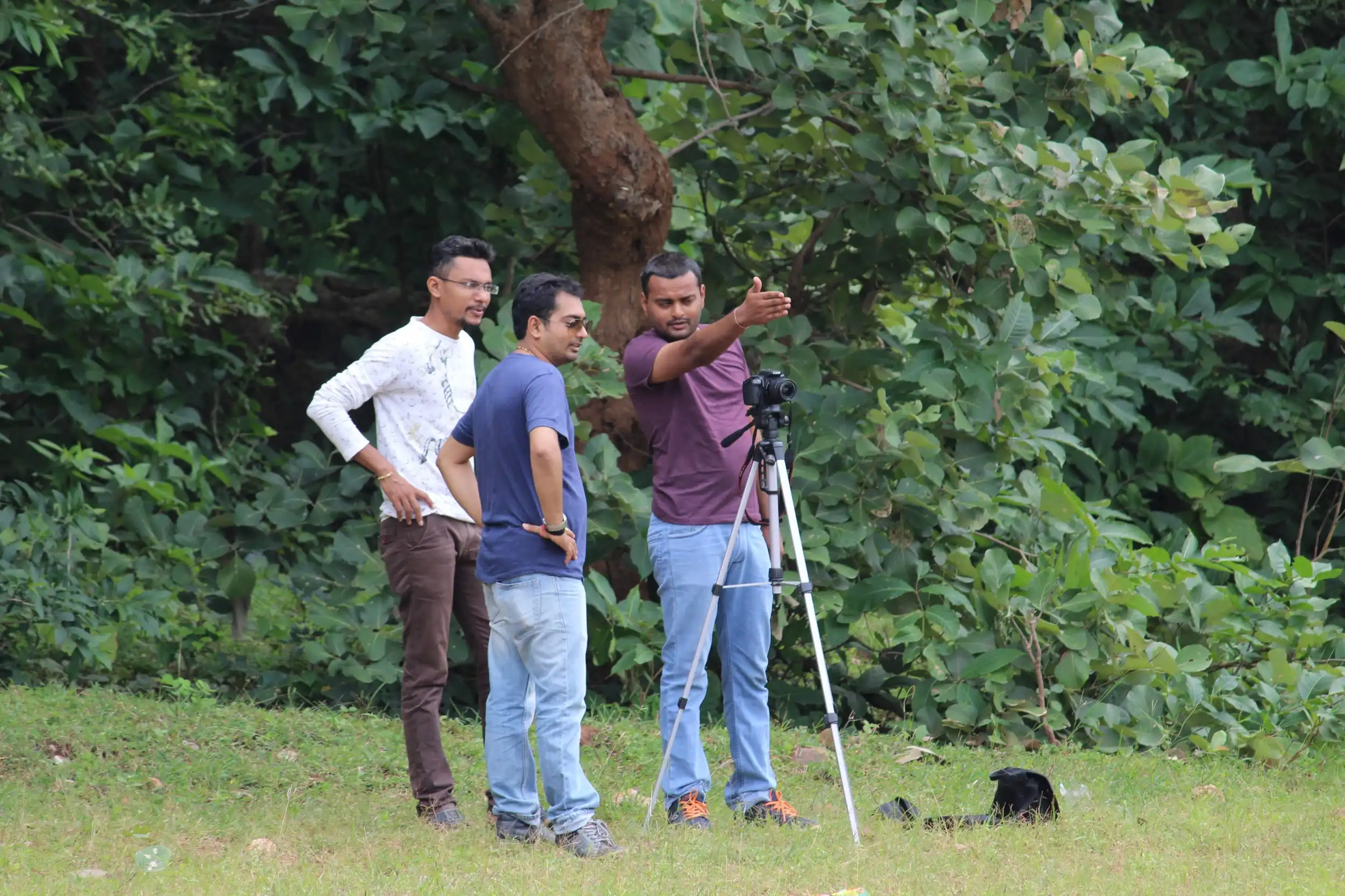 Three of us with a camera on a tripod on a photo walk