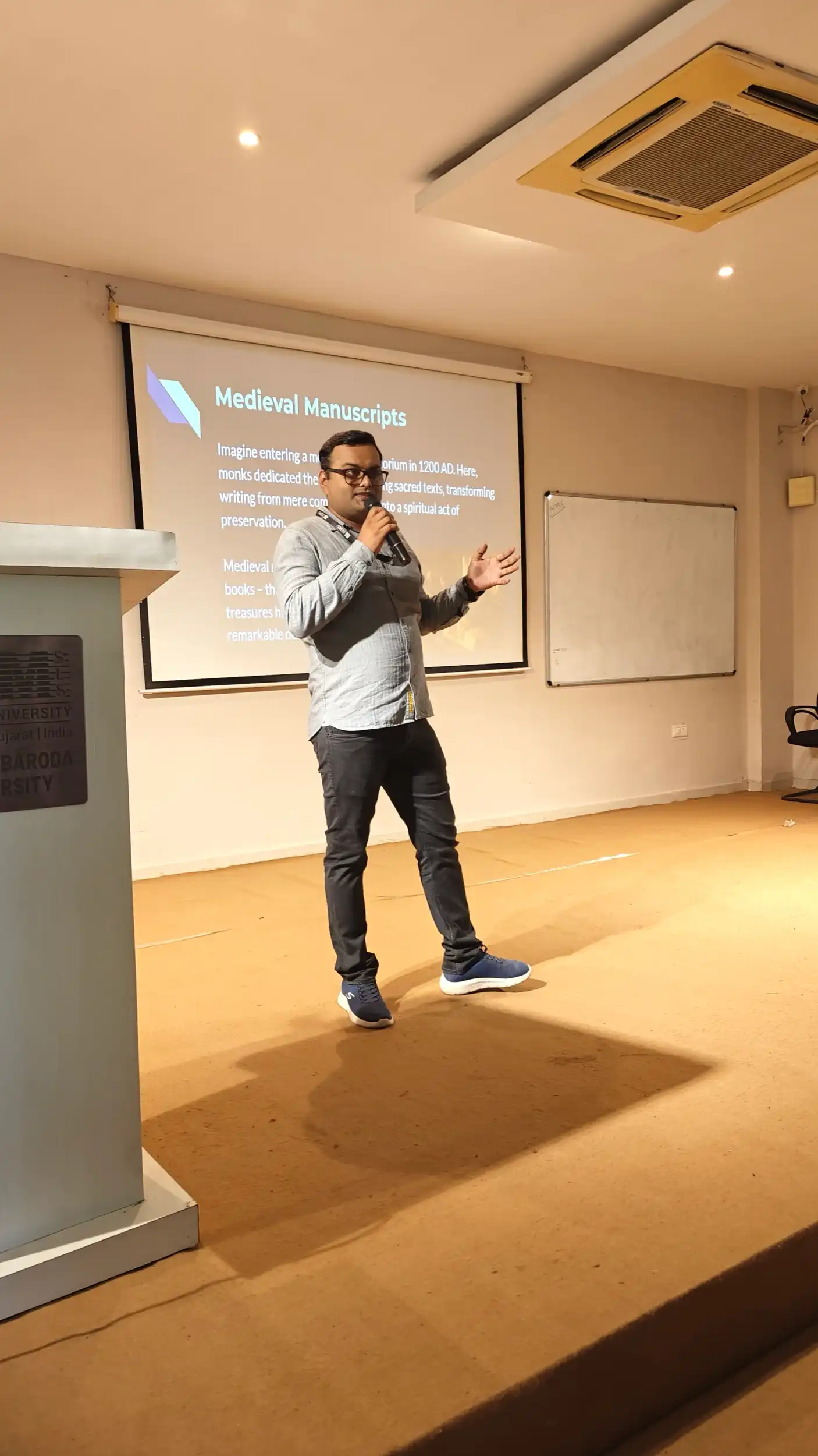 Speaking on stage at a design talk