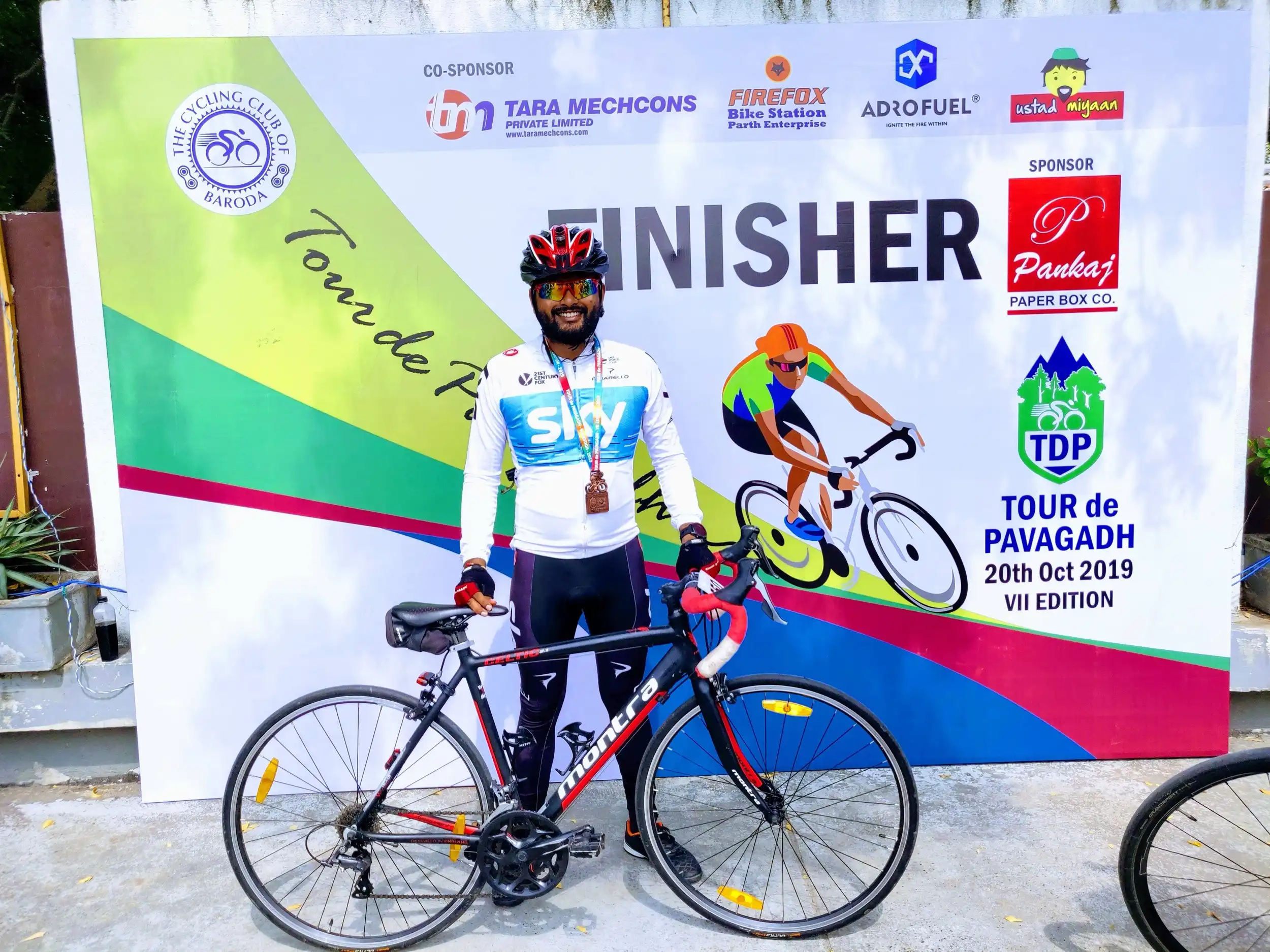 With my bike at the Tour de Pavagadh 2019 finisher board